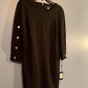 Fitted black dress, 3/4 sleeve with gold buttons